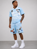 Majestik 'Champion' Rhinestone Rugby Patched Polo Shirt In Light Blue