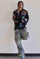 First Row Y2K utility cargo denim jeans in medium stone tint with multiple pockets and relaxed fit.