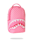A pink patterned backpack featuring a large shark mouth graphic with white and pink teeth on the front, shown against a plain white background. By Fresh N Fitted