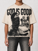 Cream oversized cropped T-shirt by PAPERCUT with "God is Good" graphic design, casual style, and relaxed fit.