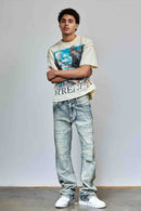 First Row allover rhinestone flare fit denim jeans in medium stone tint, showing detailed rhinestone embellishments and classic denim fit.