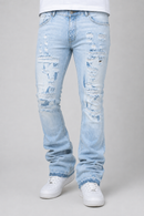 Light wash blue distressed jeans with ripped details on the thighs and knees, shown on a model wearing white sneakers against a light gray background.
