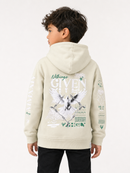 A child model shown from the back wearing a light beige Givenchy hoodie with a large graphic print featuring a white angel and green text details.