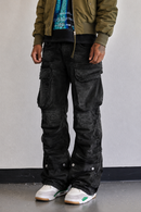 First Row Y2K black utility cargo denim jeans with relaxed fit, featuring multiple pockets and a stylish, casual design.