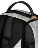 Close-up of a backpack showing the top handle, black padded shoulder straps, and a light gray patterned outer panel with a small gold zipper pull.