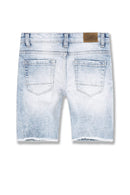 Light blue denim shorts with a worn-in look on a white background