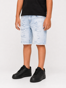 A child wearing light-wash distressed denim shorts with a frayed hem, paired with a black t-shirt and black sneakers, shown from the waist down against a plain white studio background.