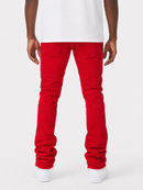 A person shown from the back wearing bright red slim-fit jeans, a white t-shirt, and white sneakers against a light gray studio background.