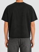 Black Papercut 'Eternity' oversized cropped T-shirt displayed on a hanger, showcasing its relaxed fit and modern style.