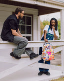 Sprayground Collage of Fun backpack featuring colorful graphic design and adjustable straps for stylish everyday accessories.