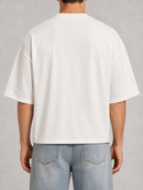 White oversized cropped T-shirt from Silent Verse with "Faith Found In Silence" graphic, casual and stylish for everyday wear.