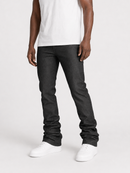 A person wearing dark charcoal gray slim-fit jeans, a white t-shirt, and white sneakers, shown from the chest down against a light gray studio background.