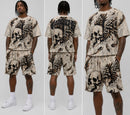 Rebel Minds cream tapestry t-shirt with skull and wing graphic. Features rhinestone embellishments.